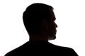 Portrait of a young man, back view - dark isolated silhouette