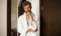 Portrait of young man in bathrobe. Royalty Free Stock Photo