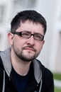 Portrait of a young man with beard wearing glasses Royalty Free Stock Photo