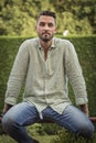 Portrait of a young man. Bearded man posing. Man wearing a green linen shirt. Surrounded by nature Royalty Free Stock Photo