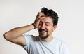 Portrait of a young man with braces smiling. A happy young man with braces on a white background Royalty Free Stock Photo