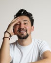 Portrait of a young man with braces smiling. A happy young man with braces on a white background Royalty Free Stock Photo