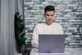 Portrait of young man businessman working  at  office with laptop on desk Royalty Free Stock Photo