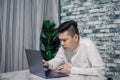 Portrait of young man businessman working  at  office with laptop on desk Royalty Free Stock Photo