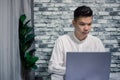 Portrait of young man businessman working at office with laptop on desk Royalty Free Stock Photo