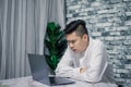 Portrait of young man businessman working  at  office with laptop on desk Royalty Free Stock Photo