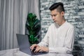 Portrait of young man businessman working  at  office with laptop on desk Royalty Free Stock Photo