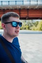 Portrait of young man in casual clothes and with sunglasses. Royalty Free Stock Photo