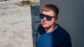 Portrait of young man in casual clothes and with sunglasses. Royalty Free Stock Photo