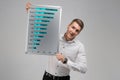 Portrait of young man with clean magnetic Board in his hands on white background