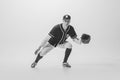 Portrait of young man, college student, baseball player, pitcher training, catching ball. Black and white photography Royalty Free Stock Photo