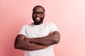 Portrait of young man crossed hands posing in glasses Royalty Free Stock Photo