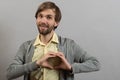 Portrait of young man doing heart gesture Royalty Free Stock Photo