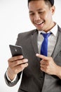 portrait young man entrepreneur excited holding phone office work concept looking at the phone