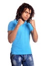 Portrait of young man fighting against white background