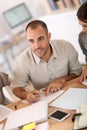 Portrait of young man filling form Royalty Free Stock Photo