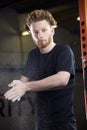 Portrait Of Young Man In Gym Lifting Weights On Barbell Royalty Free Stock Photo