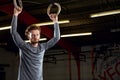 Portrait Of Young Man In Gym With Olympic Rings Royalty Free Stock Photo