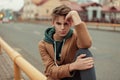 Portrait of a young man with a haircut in a trendy coat Royalty Free Stock Photo