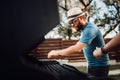 Portrait of young guy having a barbecue grill, cooking meat and vegetables