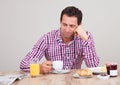 Portrait Of Young Man Having Breakfast Royalty Free Stock Photo