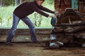 Portrait of young man hold hydraulic tool in abandoned building, street art photo Royalty Free Stock Photo