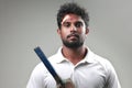 Portrait of a young man holding bat  with a bruised forehead Royalty Free Stock Photo