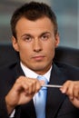 Portrait of young man holding pen Royalty Free Stock Photo