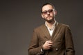 Portrait of young man in jacket on brown background Royalty Free Stock Photo