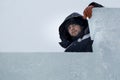 Portrait of an assembler worker in a jacket with a hood at the construction of an ice camp Royalty Free Stock Photo