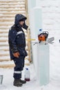 Portrait of an assembler worker in a jacket with a hood at the construction of an ice camp Royalty Free Stock Photo