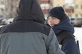 Portrait of an assembler worker in a jacket with a hood at the construction of an ice camp Royalty Free Stock Photo