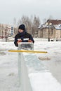 Portrait of an assembler worker in a jacket with a hood at the construction of an ice camp Royalty Free Stock Photo