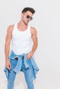 Young man in white tank top looks down to side Royalty Free Stock Photo