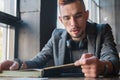 Portrait of young man male student hipster reading a book. Knowledge, education, development concept Royalty Free Stock Photo