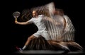 Portrait of young man, male tennis player in motion and action isolated on dark background. Stroboscope effect.