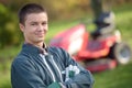 Portrait young man mower in background Royalty Free Stock Photo