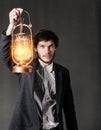 Portrait of a young man with oil lamp Royalty Free Stock Photo