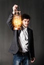 Portrait of a young man with oil lamp Royalty Free Stock Photo