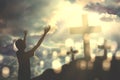 Young man praising to God with crucifixes Royalty Free Stock Photo