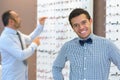 Portrait young man in opticians wearing bowtie Royalty Free Stock Photo