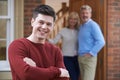 Portrait Of Young Man With Parents At Home