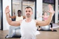 Man exercising with pilates ball during group class Royalty Free Stock Photo