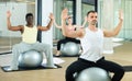Man exercising with pilates ball during group class Royalty Free Stock Photo