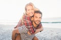 Portrait of a young man piggybacking beautiful woman Royalty Free Stock Photo