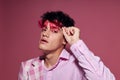 portrait of a young man pink shirt and glasses jacket fashion elegant style  background unaltered Royalty Free Stock Photo