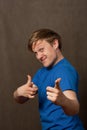 Portrait of a young man in pointing at camera