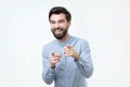 Portrait of a young man pointing his finger at you Royalty Free Stock Photo