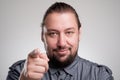 Portrait of a young man pointing his finger at you Royalty Free Stock Photo