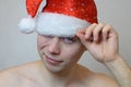 Portrait of young naked man with Santa hat Royalty Free Stock Photo